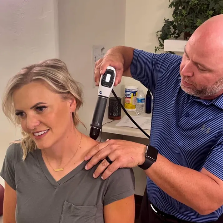 Chiropractor St George UT Brent Babcock With Shockwave Patient